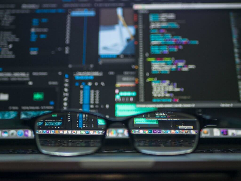 kevin-ku-364843-unsplash-1024x768 Screens showing databases and a pair of glasses on the desk